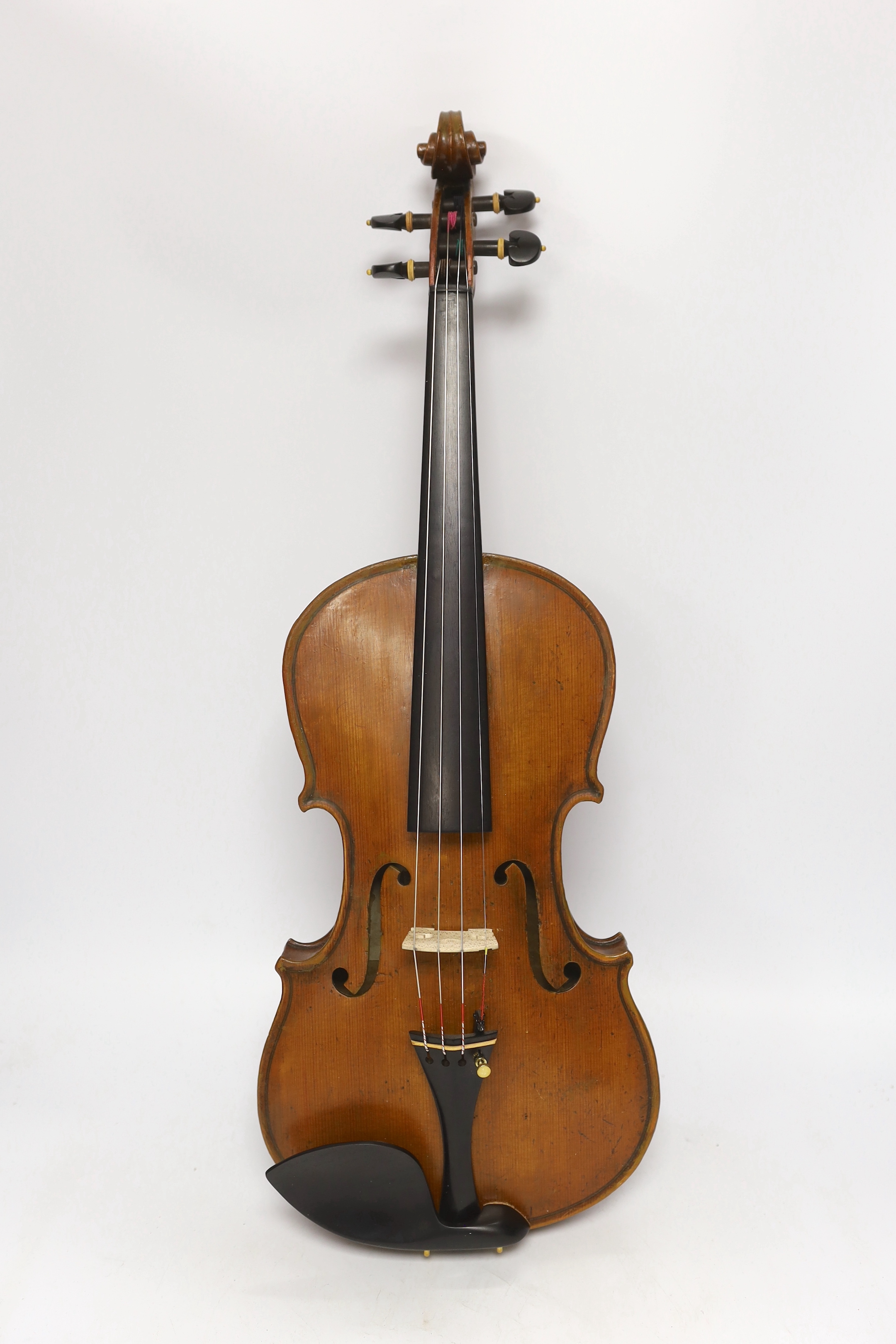 A late nineteenth century English violin by Hidalgo with a label inside the body showing a crown over Hidalgo, with a bow in an ebonised wooden case, body 36cm